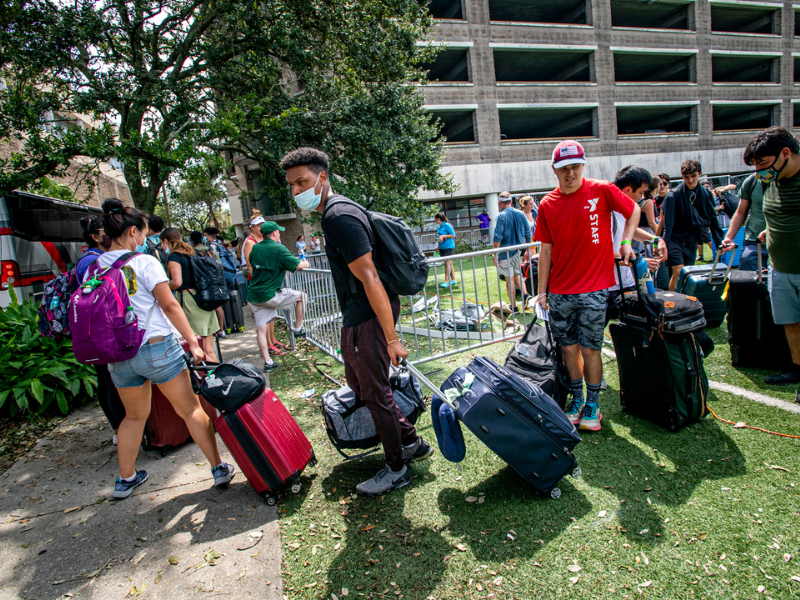 Photos of students getting on to bus to go to Houston, TX after Hurricane Ida